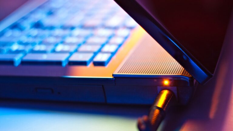 How to Keep Your Gaming Laptop Battery from Exploding Gaming laptop image with charger connected