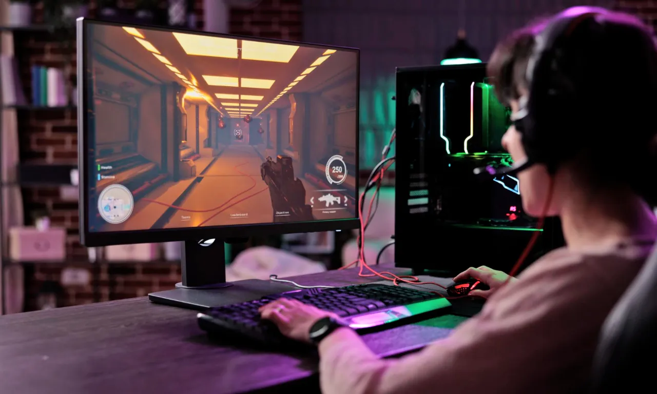 A person playing game on a gaming PC.