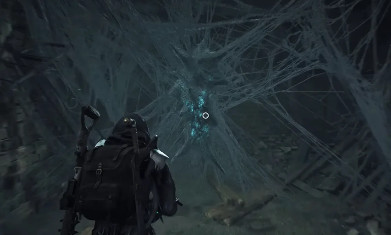 Interacting with cobweb on the wall with Nightweaver Stone Doll to get the weapon in Remnant 2.