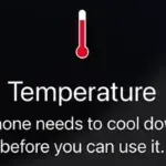 iPhone showing temperature warning screen with red thermometer icon.