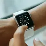 Unpair or Reset Apple Watch - Person wearing aluminium case Apple Watch with white sports band.