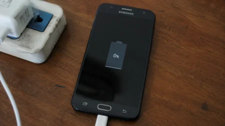 Why Won’t My Phone Charge? 12 Ways to Fix Android Charging Issues Android phone plugged into charger not charging showing 0 percent battery on screen.