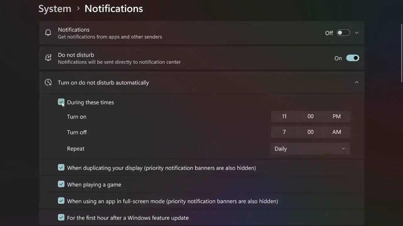 Windows 11 system notifications settings screen showing options to turn on do not disturb automatically during specific times.