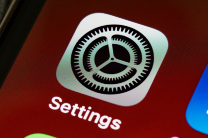 Close-up of the iOS Settings app icon on a smartphone screen